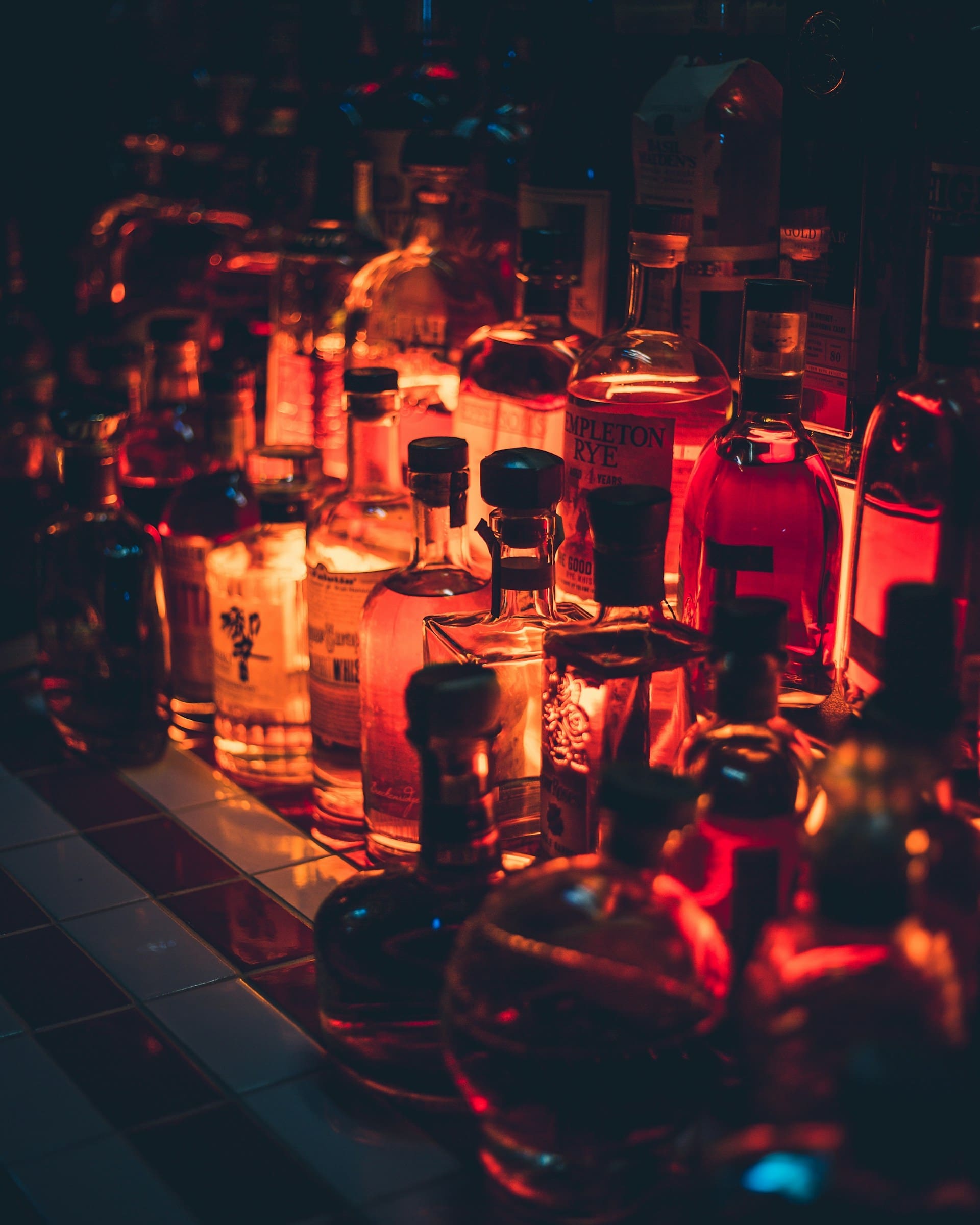 An image of liquor bottles at a bar.
