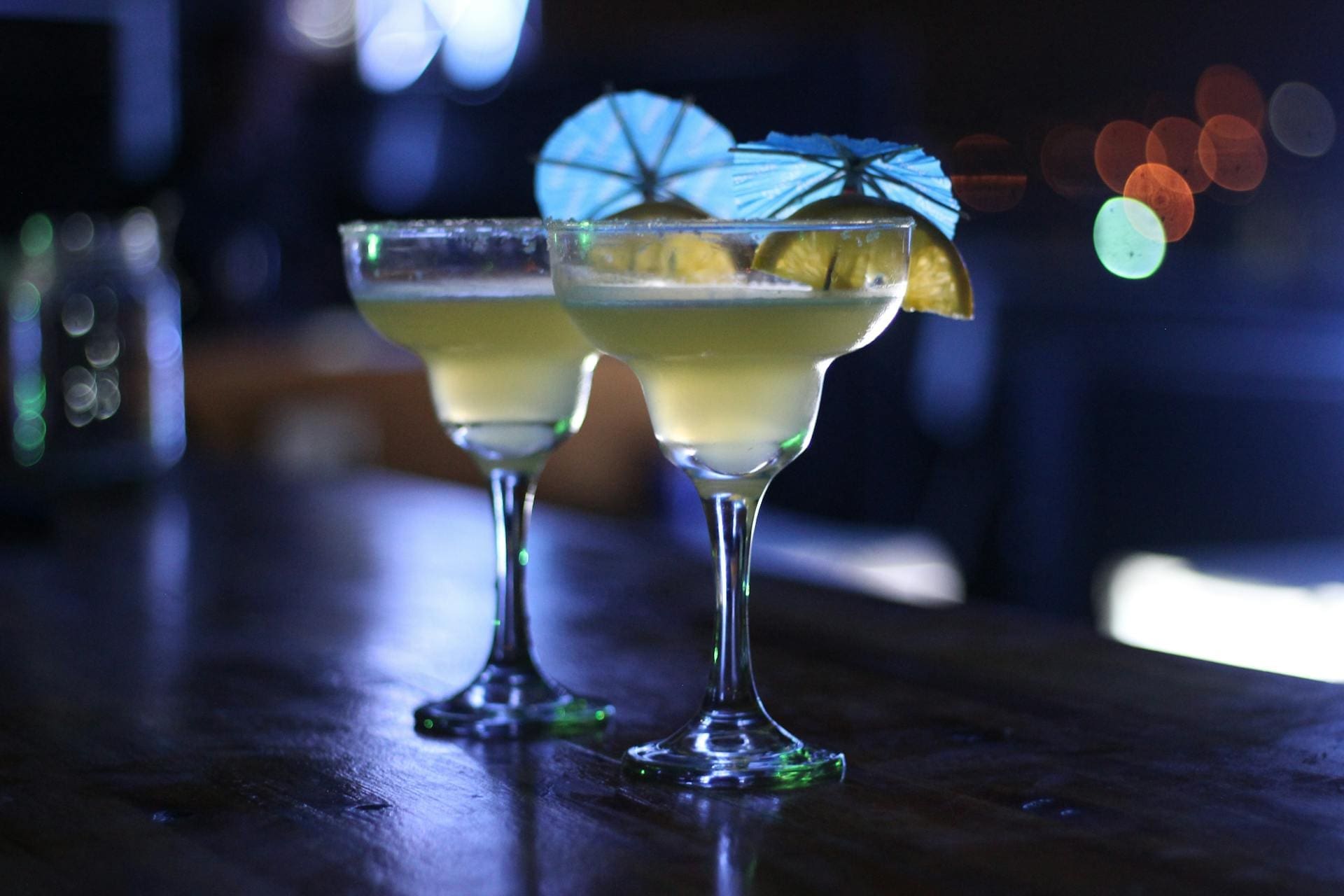 An image of two drinks in martini glasses.