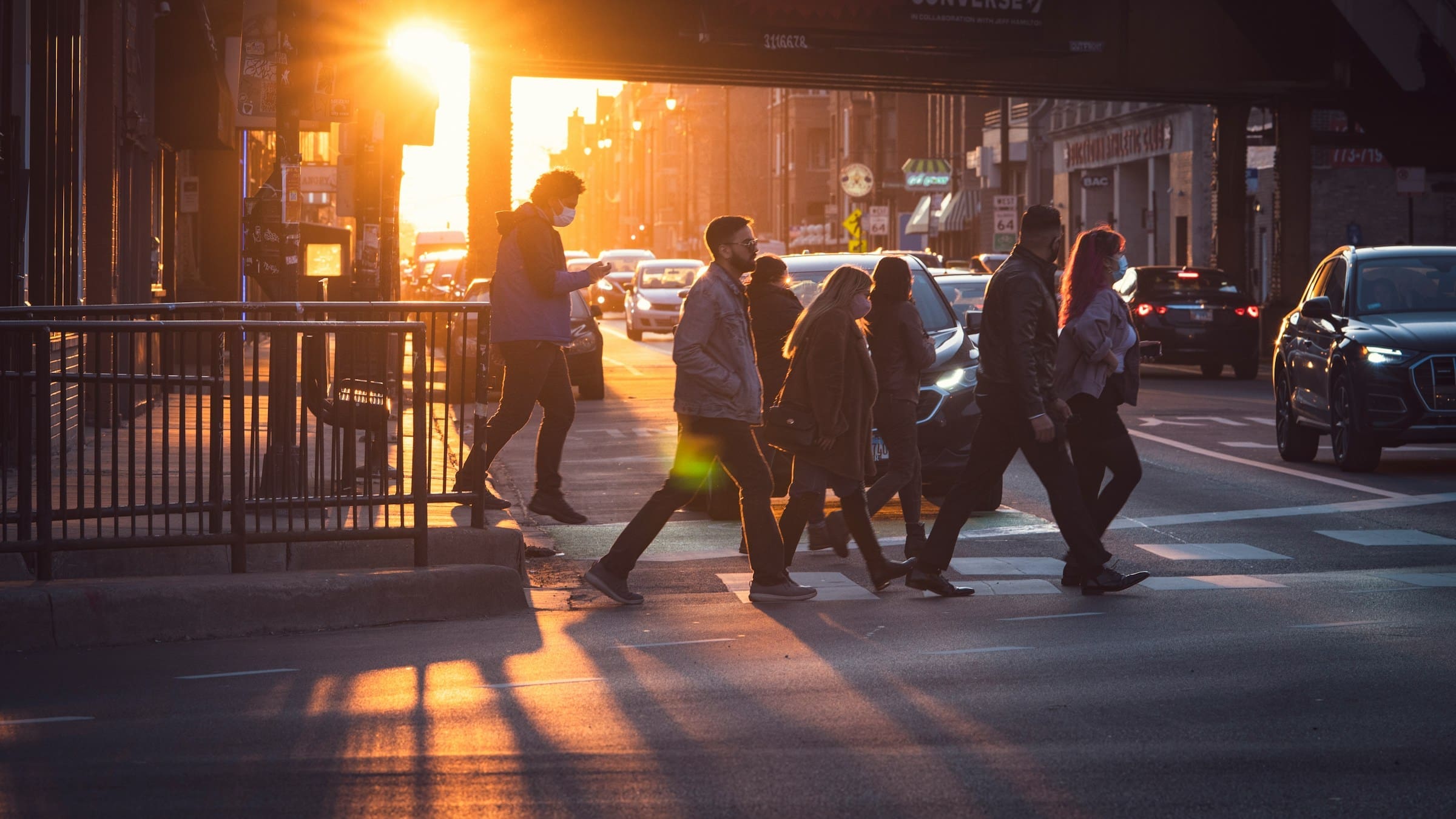People walking across a street in Wicker Park, Chicago.
