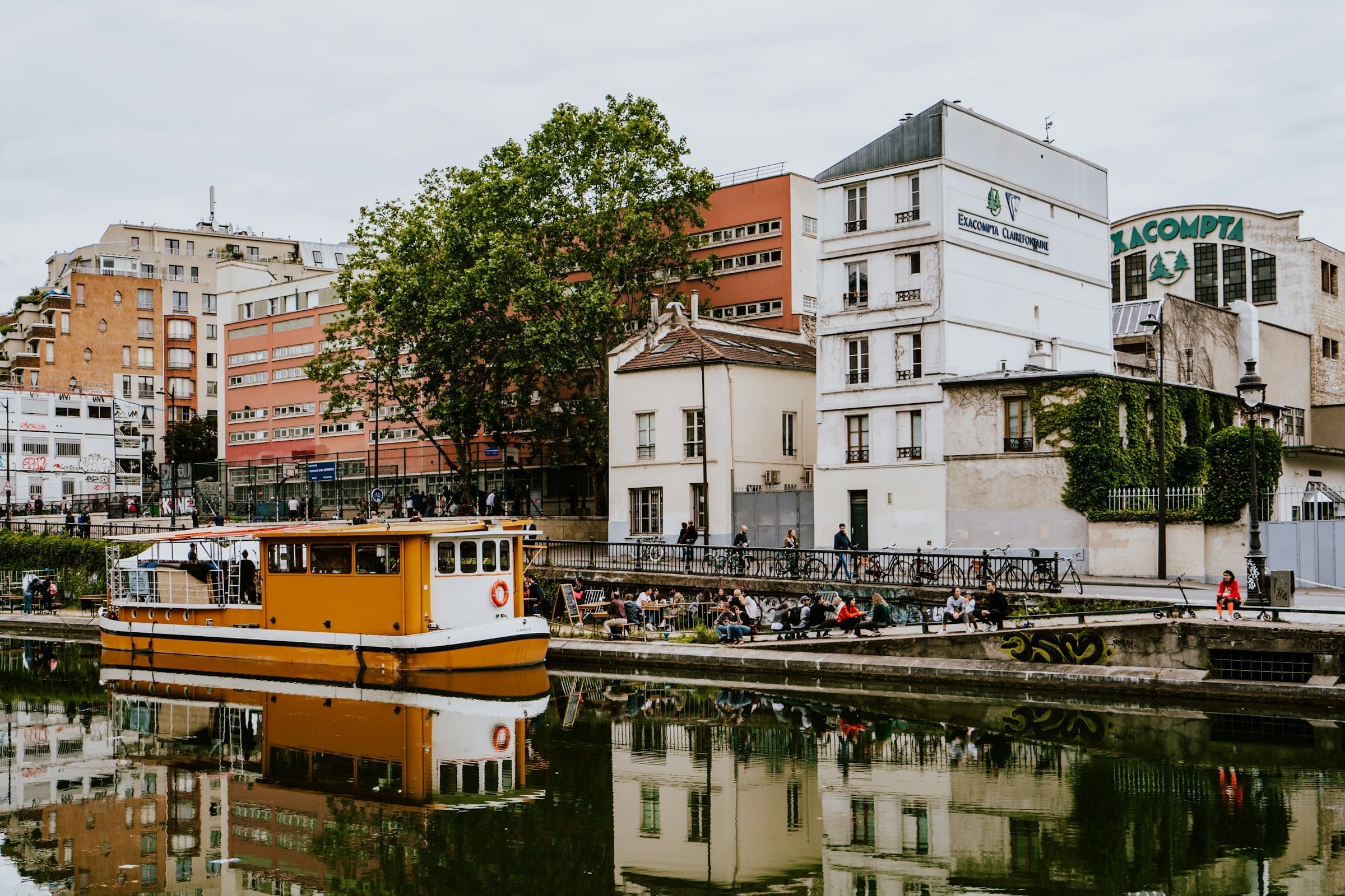 A photo of people relaxing along Canal Saint Martin in Paris, France.